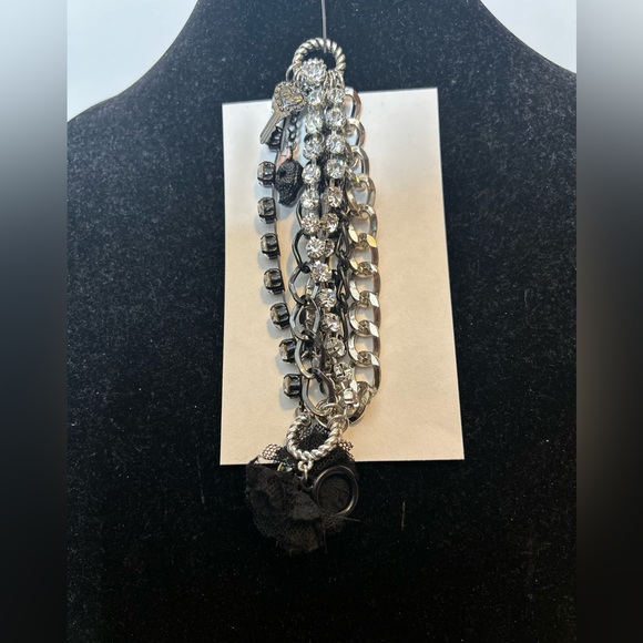 Betsey Johnson Chain/Charm bracelet
Silvertone/black/rhinestones 
Skull Key logo - Picture 2 of 11